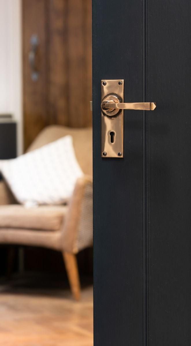 Polished Copper Lever Lock Door Handle in Situ