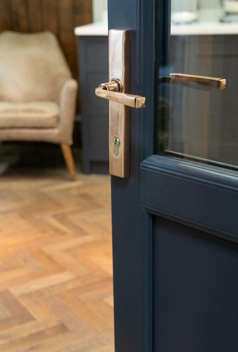 Polished Copper Slimline Espag Door Handle on Door