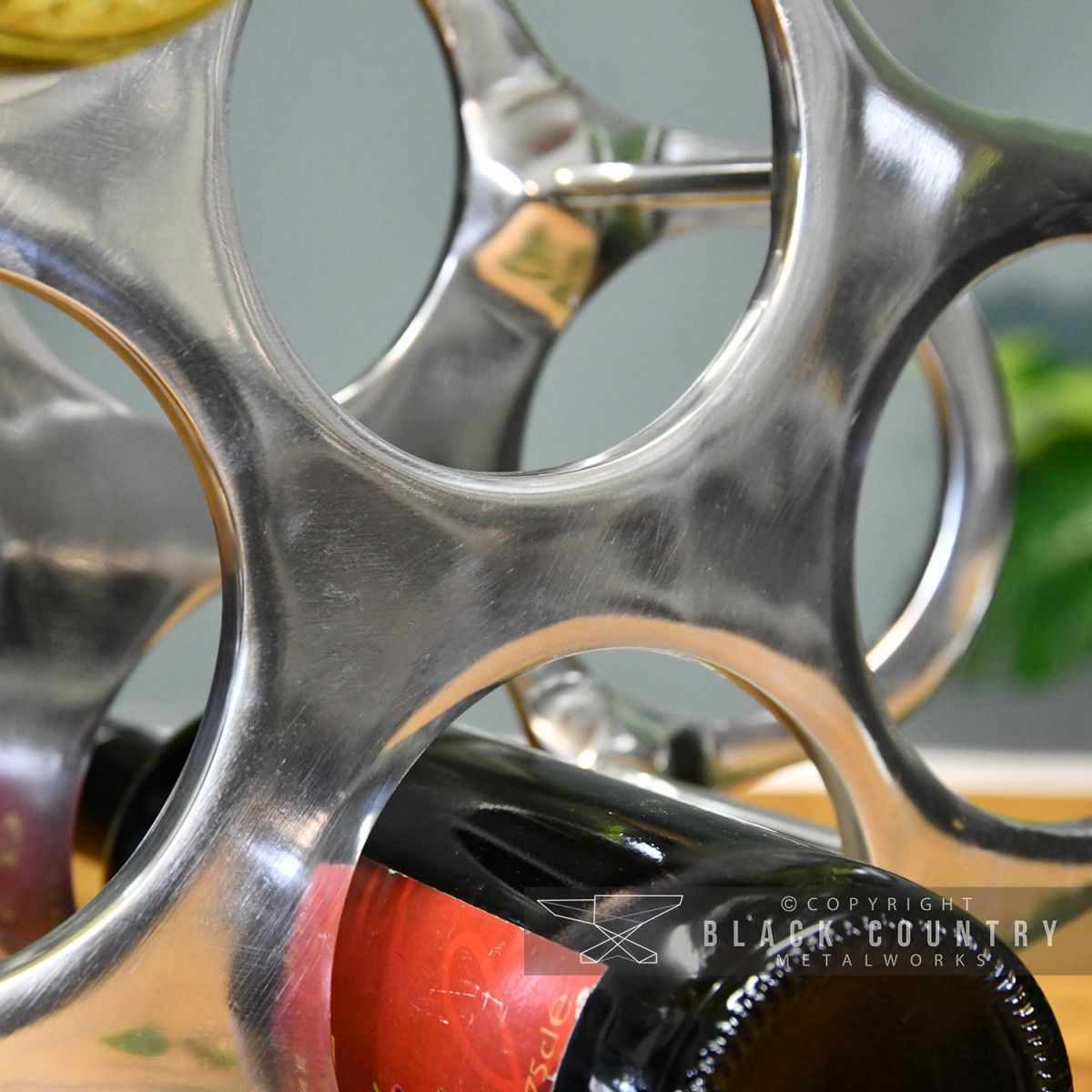 Polished Nickel Finish on the "Cloud" Wine Rack