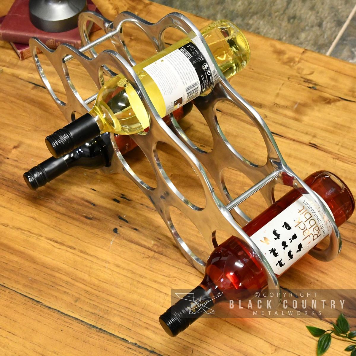 top View of Bottles Being Held in the Polished Nickel "Cloud" Wine Rack