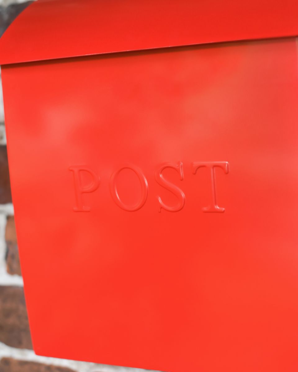 Close Up Of The Post Motif On The Modern Red Post Box