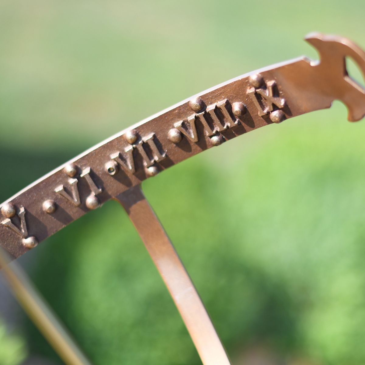 Roman Numerals inside the Armillary