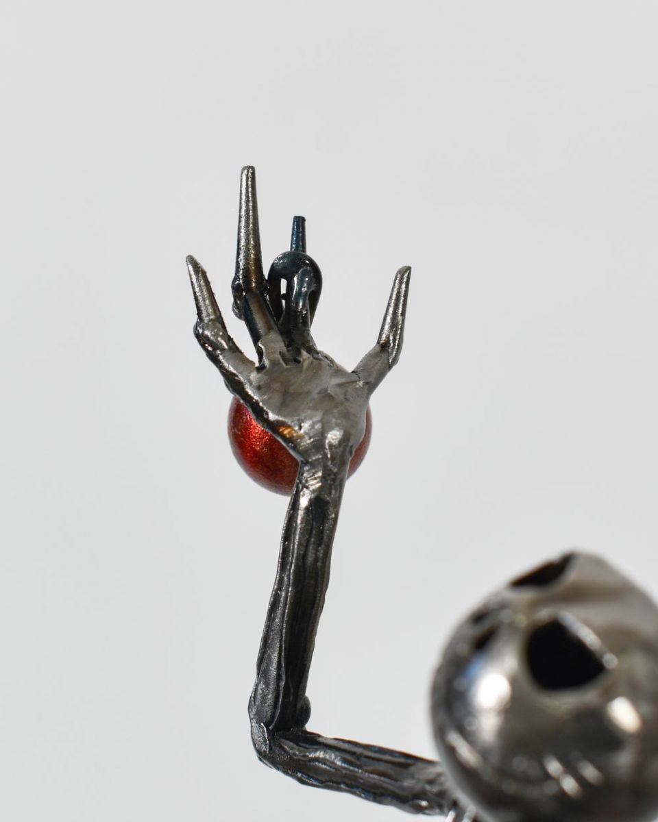 Close up of The Pumpkin King Sculpture top hand with bauble Close up of The Pumpkin King Sculpture top hand with bauble