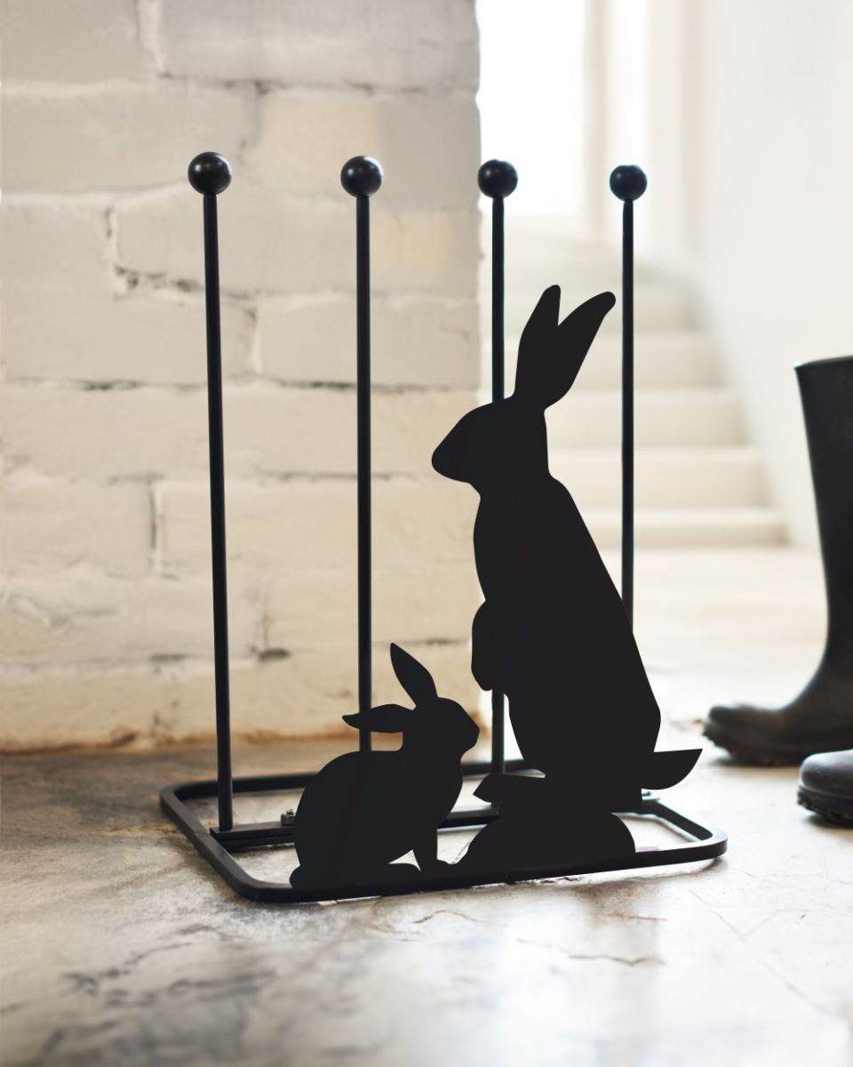 Rabbit boot rack in front of white painted brick wall Rabbit boot rack in front of white painted brick wall