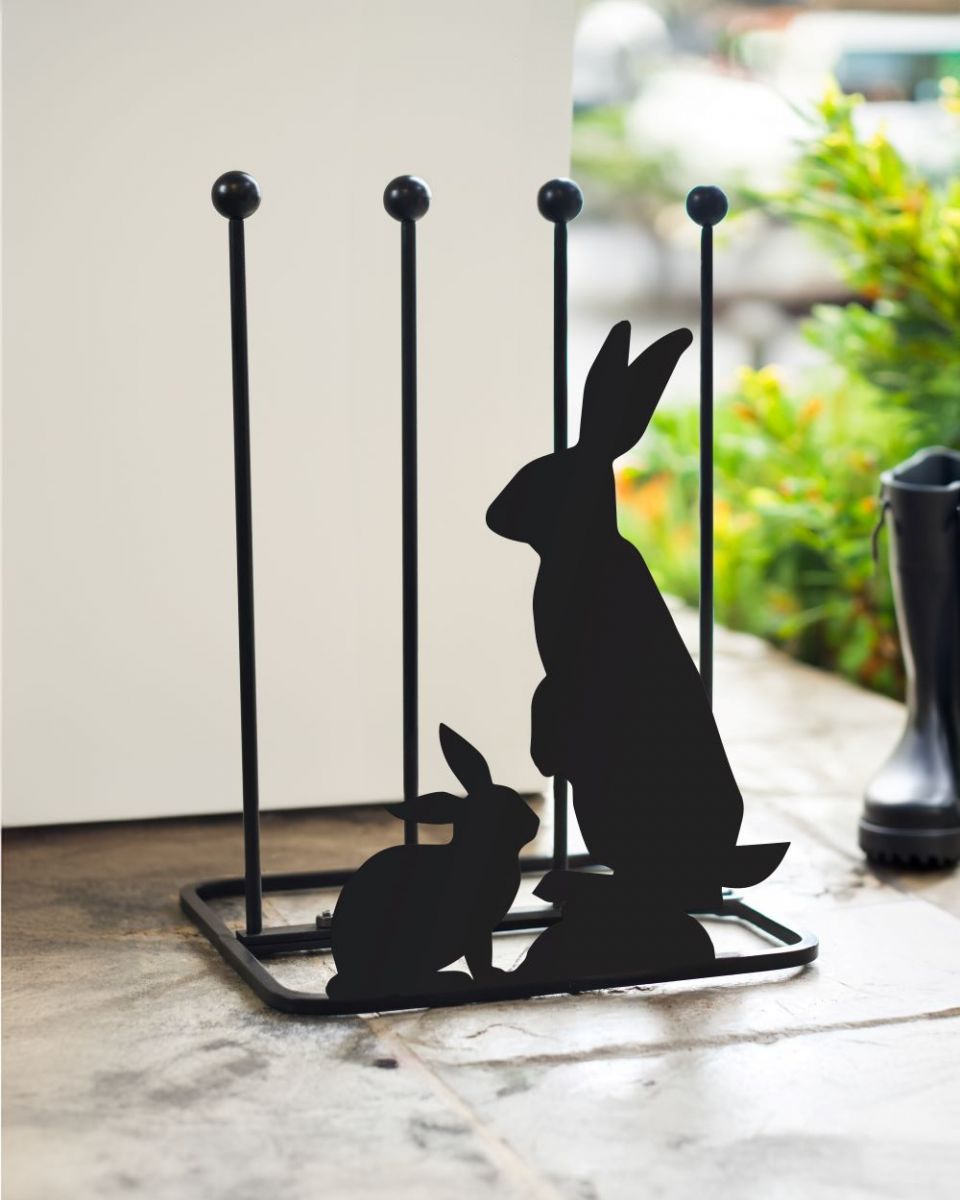 Black steel boot rack with mother and baby rabbit silhouettes Black steel boot rack with mother and baby rabbit silhouettes
