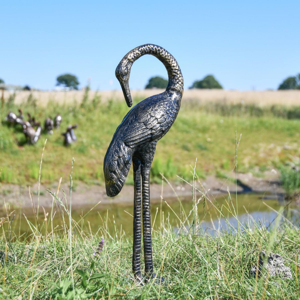 Recycled Cast Aluminium Brushed Gold "Goliath" Heron Sculpture - Facing Backwards in Situ