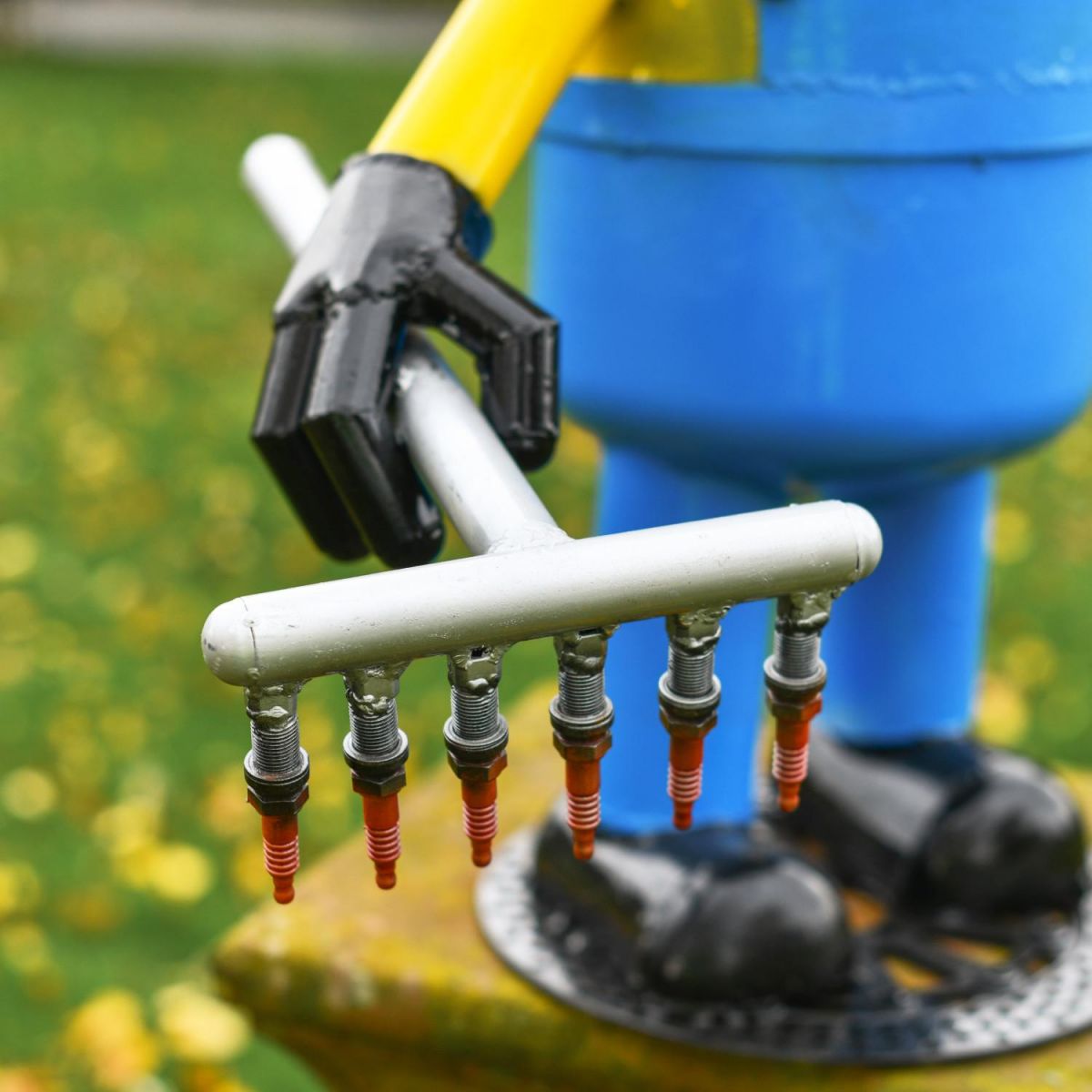 Close-Up of Rake on Recycled Metal "Giddy Gardener" Henchman Sculpture Close-Up of Rake on Recycled Metal "Giddy Gardener" Henchman Sculpture