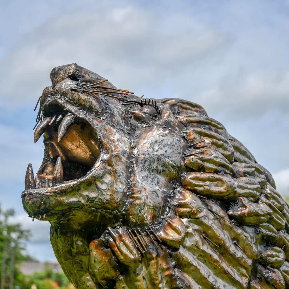 Close-up of the Face of the Recycled Metal Roaring Lion Sculpture