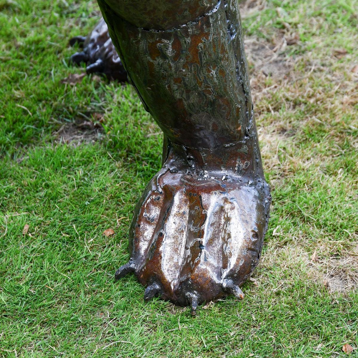 Close-up of the Feet on the Recycled Metal Roaring Lion Sculpture