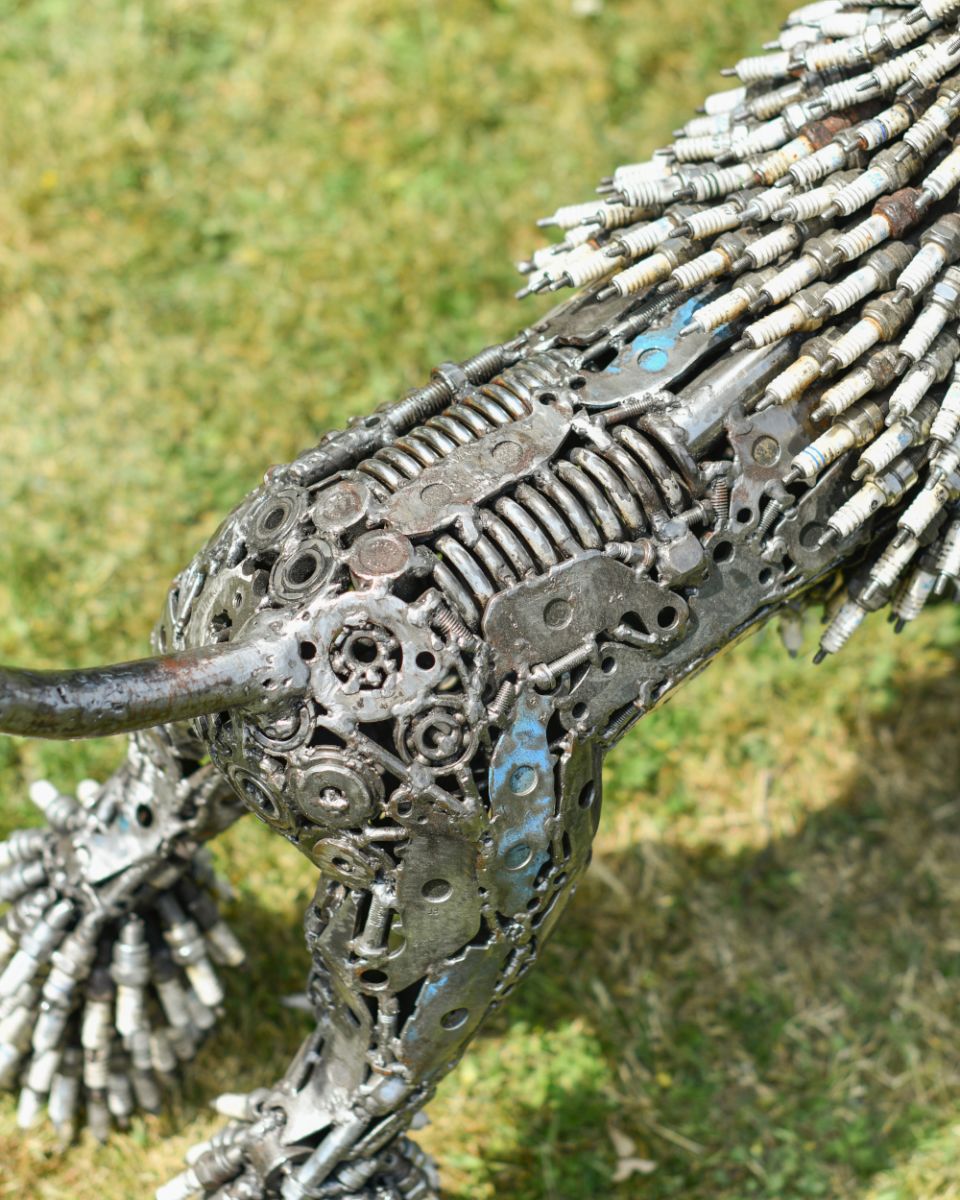 Close up of scrap metal body detail on poodle art sculpture
