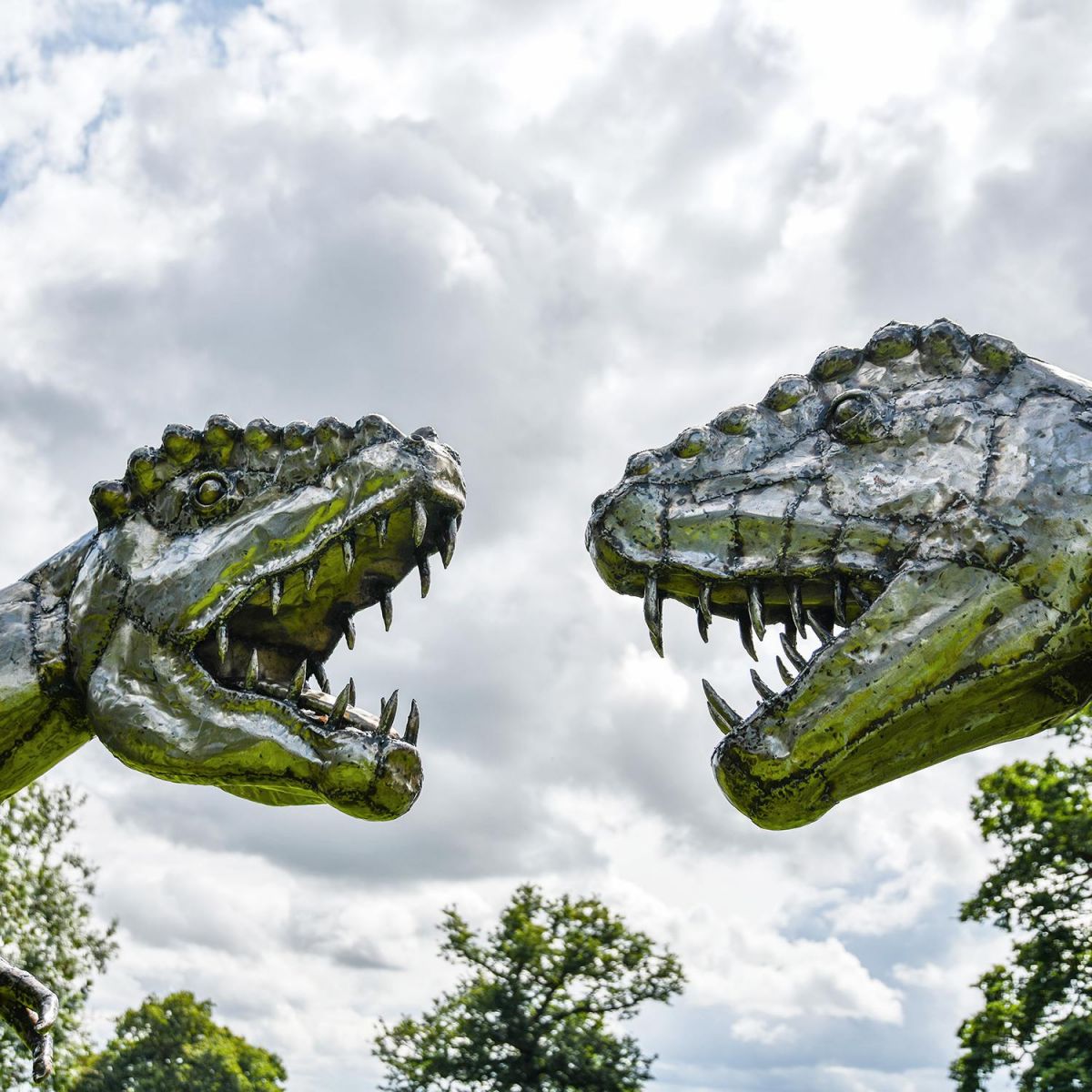 Two Recycled Metal T-Rex Sculpture"s Battling