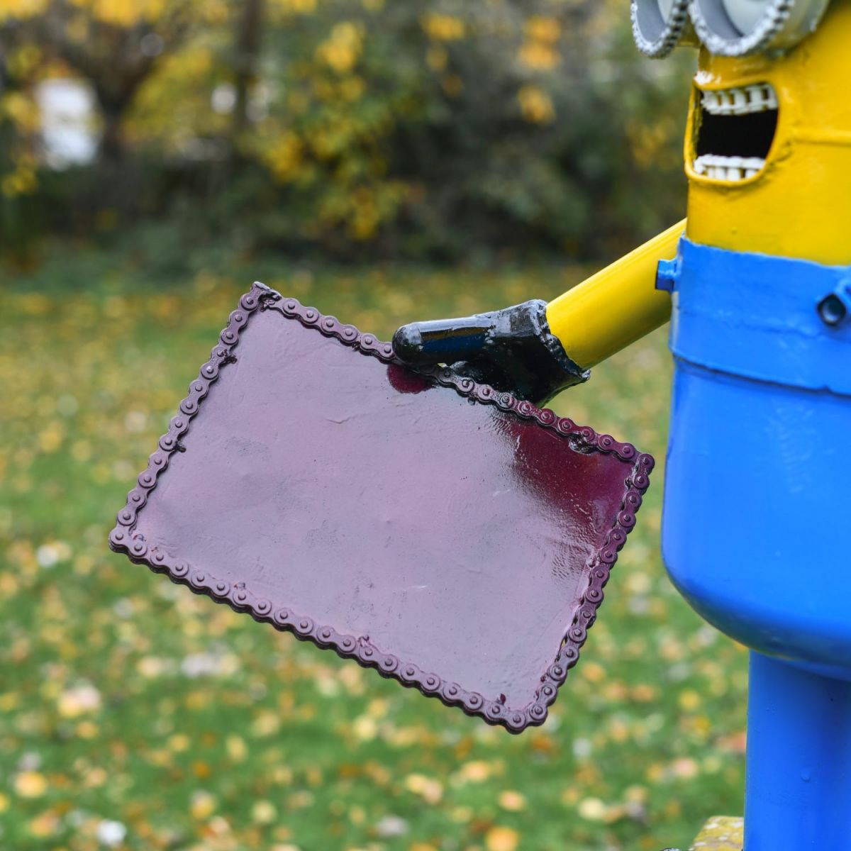 Close-Up of Clipboard on Minion Sculpture Close-Up of Clipboard on Minion Sculpture