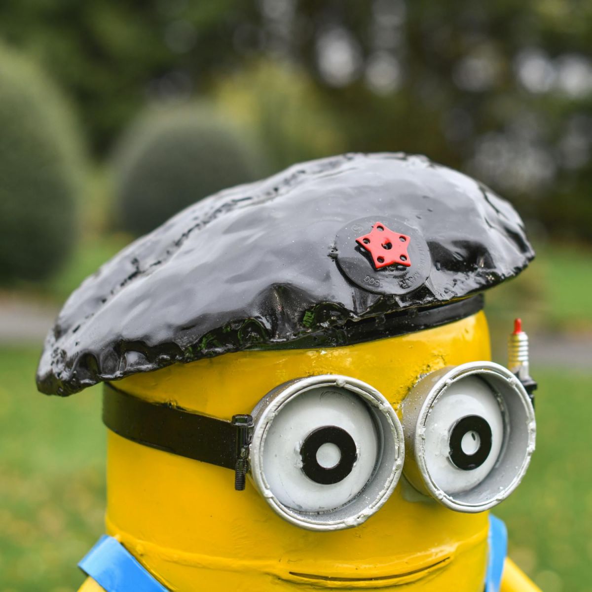 Close-Up of Flat Cap on Recycled Metal "Viva la Revolution" Henchman Sculpture