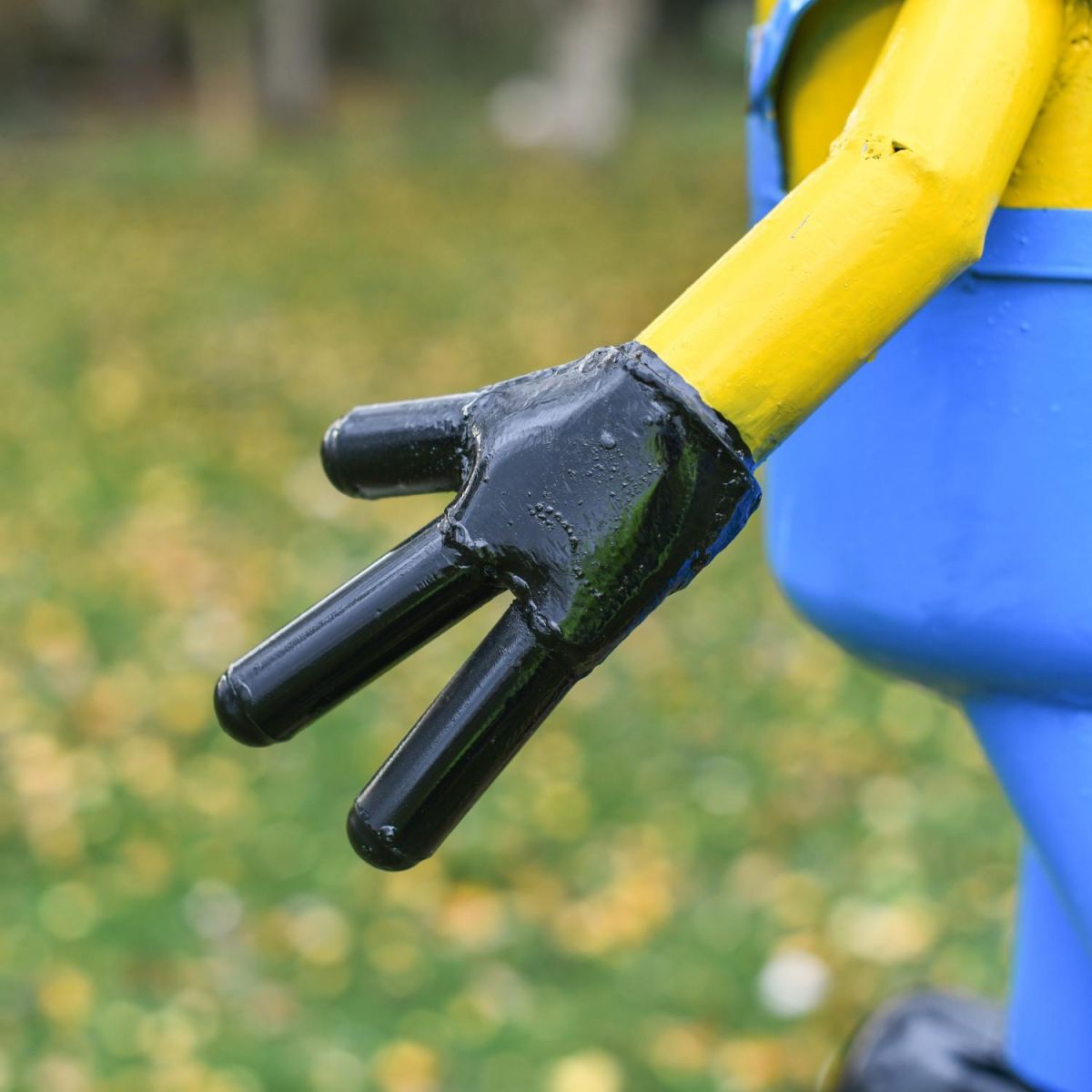 Close-Up of Hand on Recycled Metal "Worthy Workman" Henchman Sculpture Close-Up of Hand on Recycled Metal "Worthy Workman" Henchman Sculpture