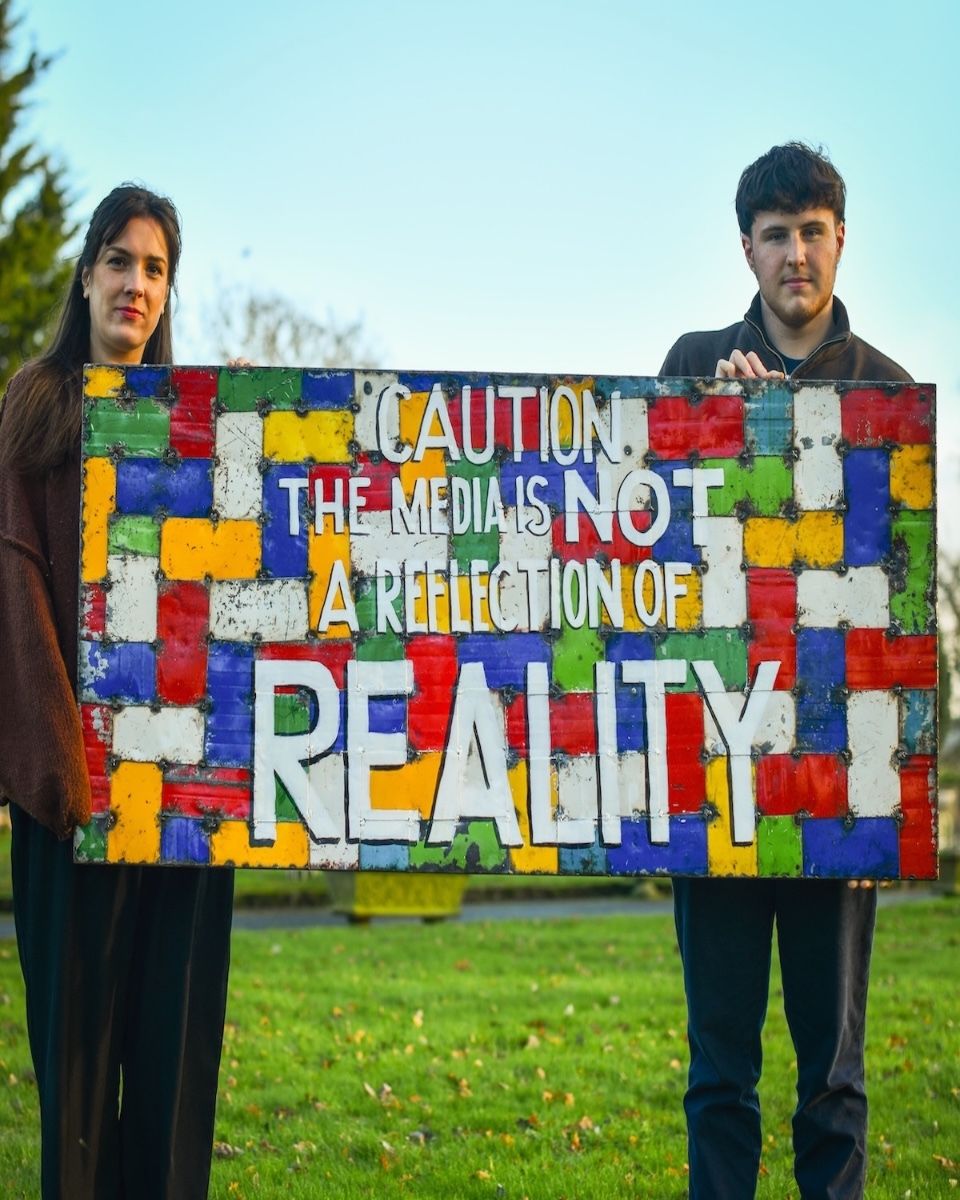 Recycled Oil drum wall art caution the media is not a reflection of reality