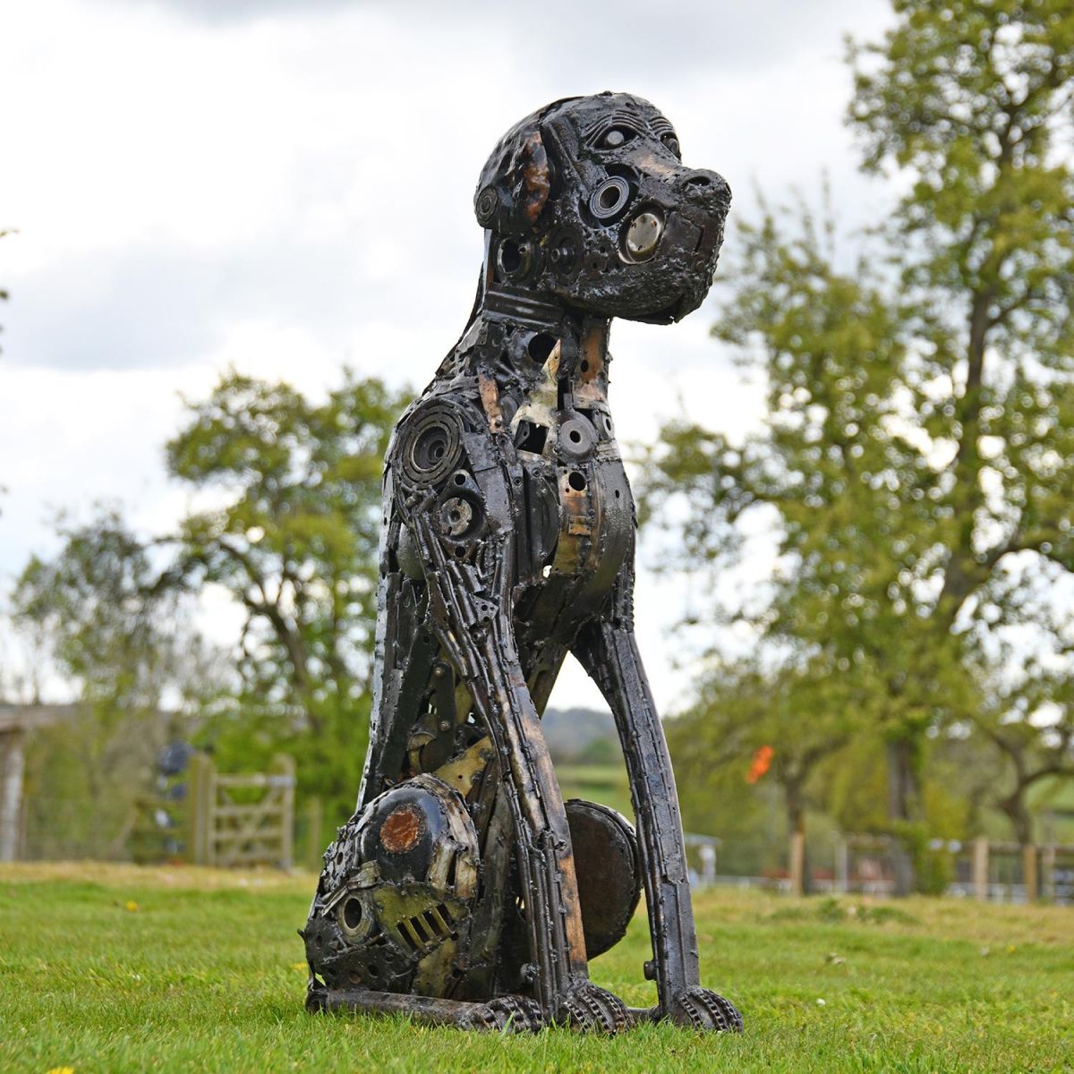 Recycled Parts Dog Sculpture in Situ in the Garden