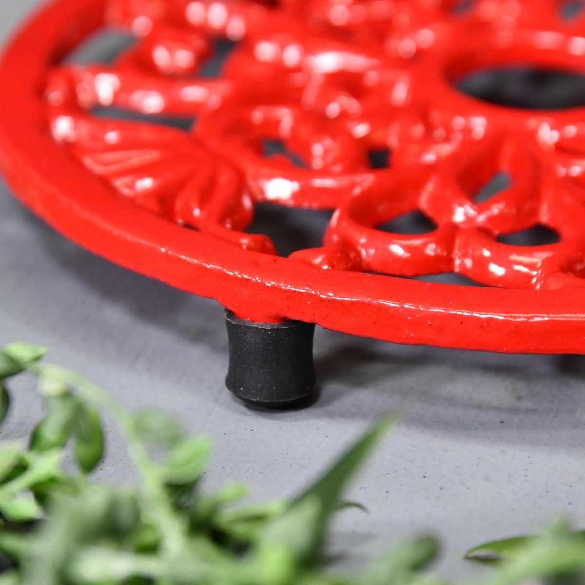 Close-up of the Feet on the Red Heavy Duty Cast Iron Round Trivet
