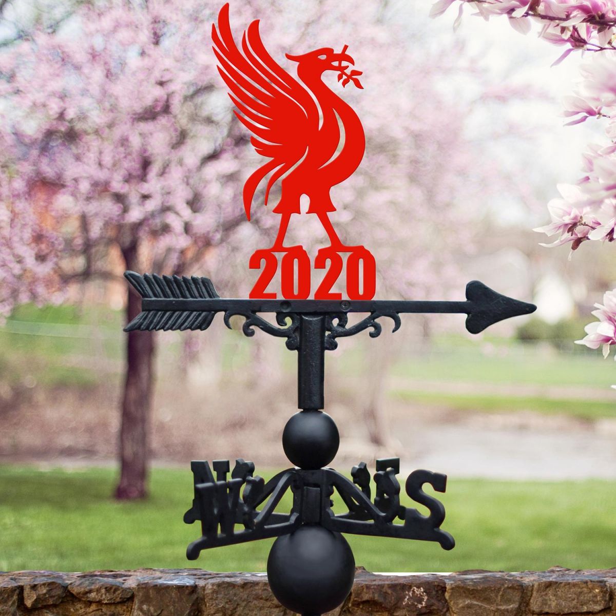 Liver Bird Weathervane in Situ by a Pink Blossom Tree