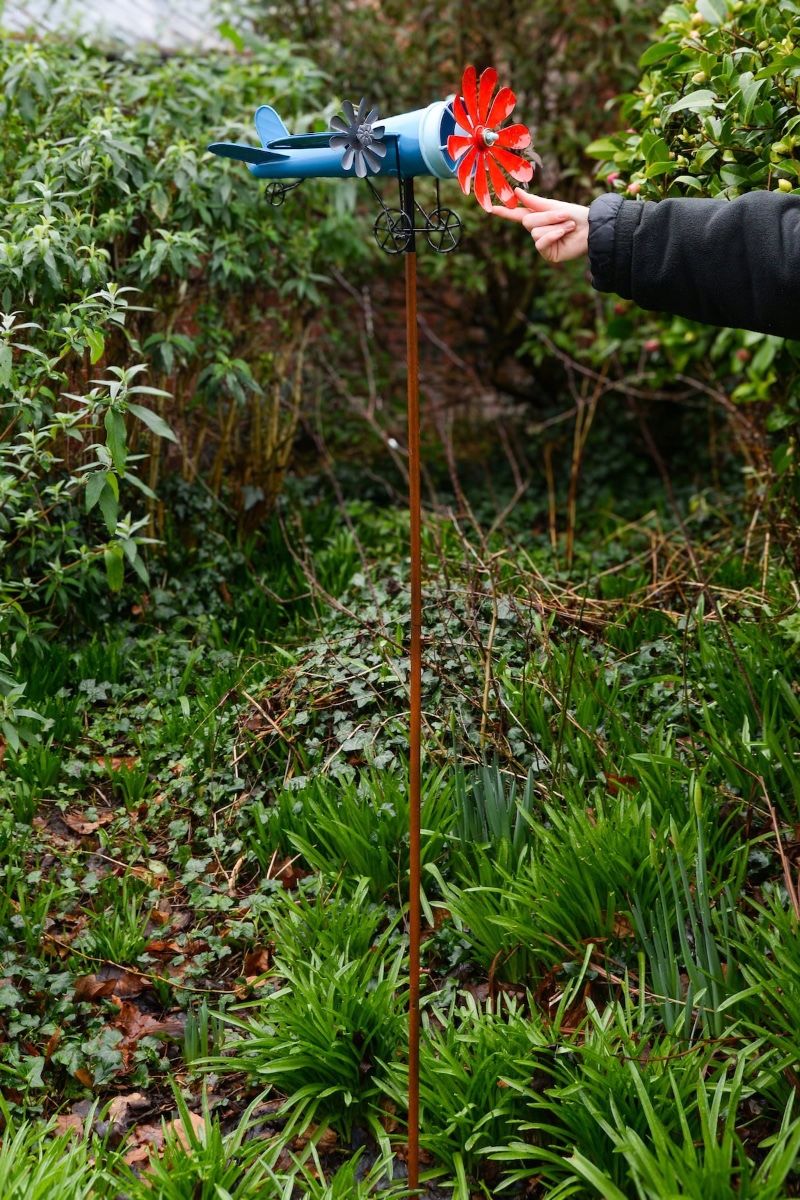 Vintage Airplane Wind Spinner Stakes - Blue and Red with Hand in Shot for Scale