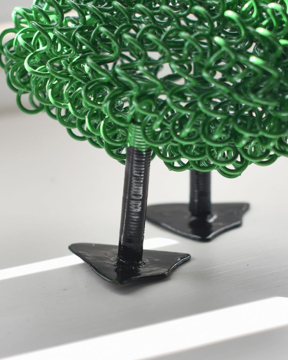 Close up of feet detail on recycled metal art sculpture Close up of feet detail on recycled metal art sculpture