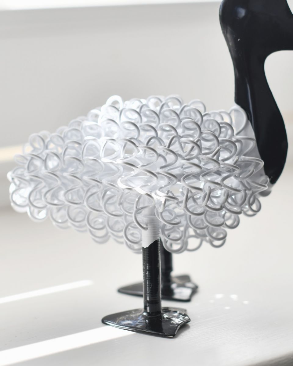 Close up of white body detail on scrap metal art sculpture Close up of white body detail on scrap metal art sculpture