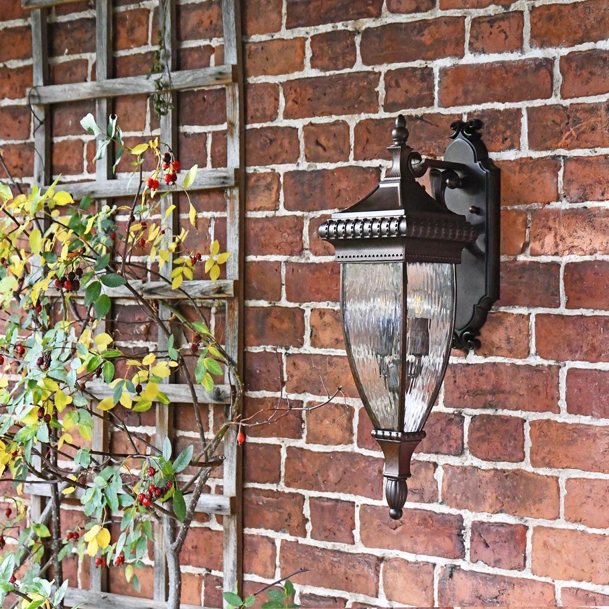 Renaissance Style Standard Hanging Bronze Wall Lantern in Sit on a Garden Wall Renaissance Style Standard Hanging Bronze Wall Lantern in Sit on a Garden Wall