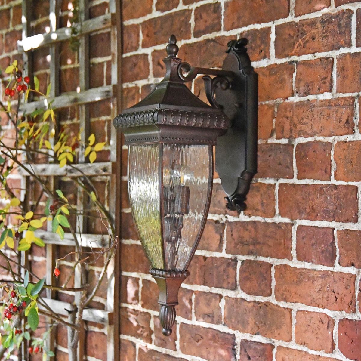 Renaissance Style Standard Hanging Bronze Wall Lantern Mounted on a Brick Wall Renaissance Style Standard Hanging Bronze Wall Lantern Mounted on a Brick Wall