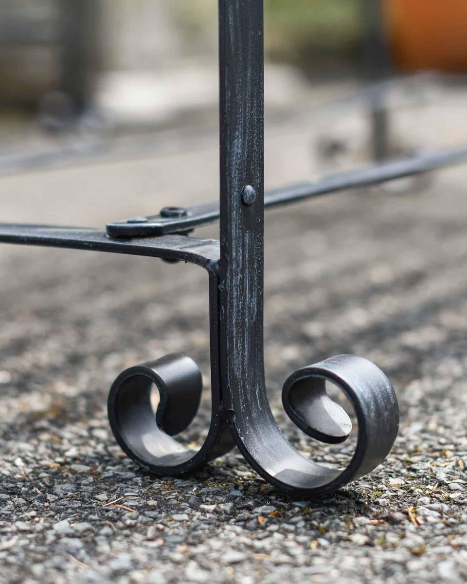 Close-Up of Arched Feet for Robust Black “Chatham" Park Table