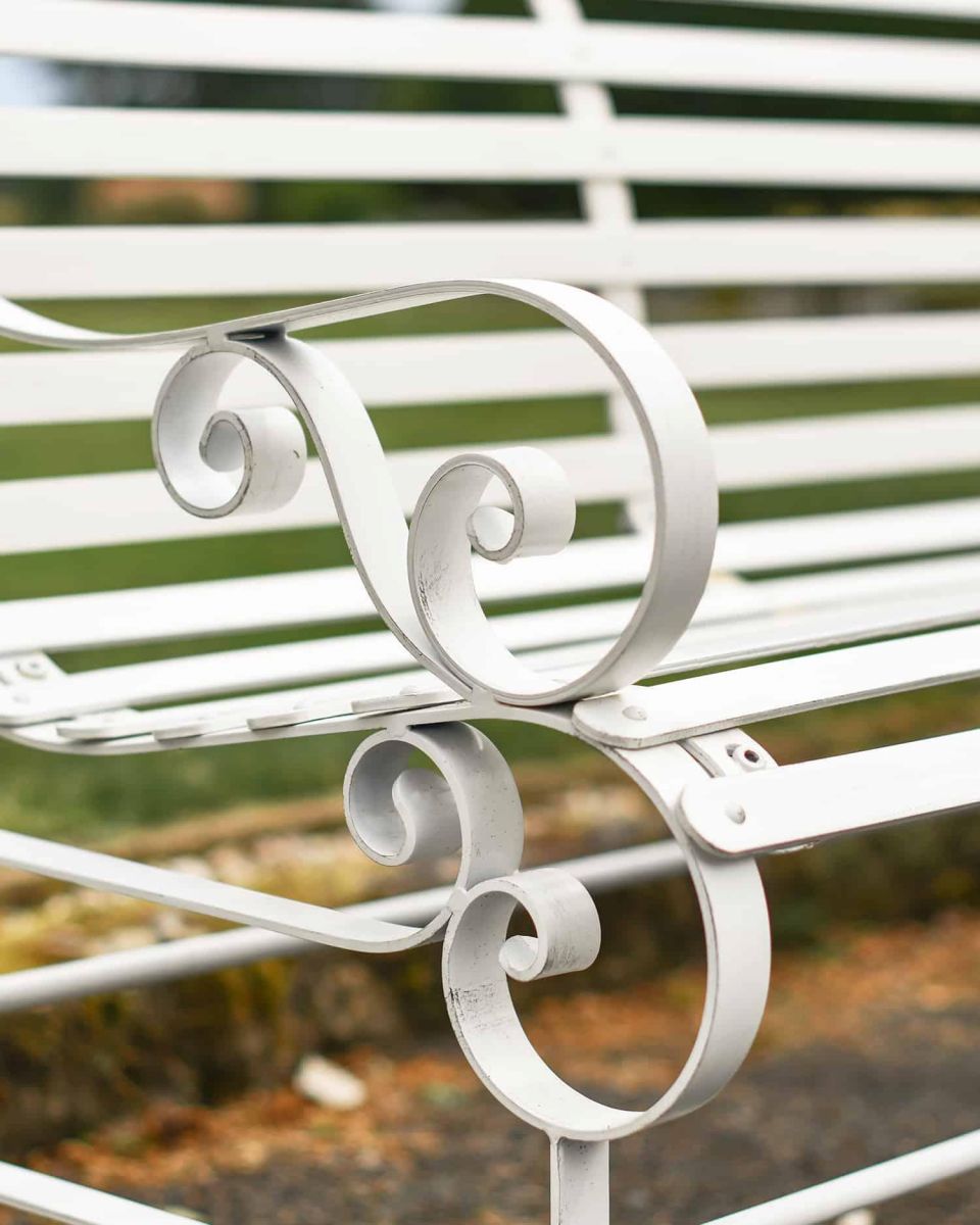 Close-Up of Ornate Armrest on Robust Cream “Chatham" Three Seater Park Bench