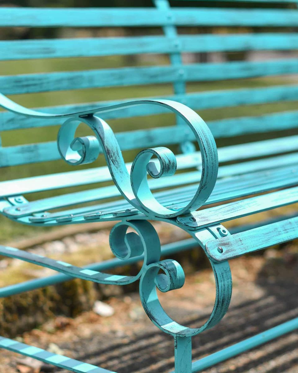 Close-Up of Ornate Armrest for Robust Green “Chatham" Three Seater Park Bench