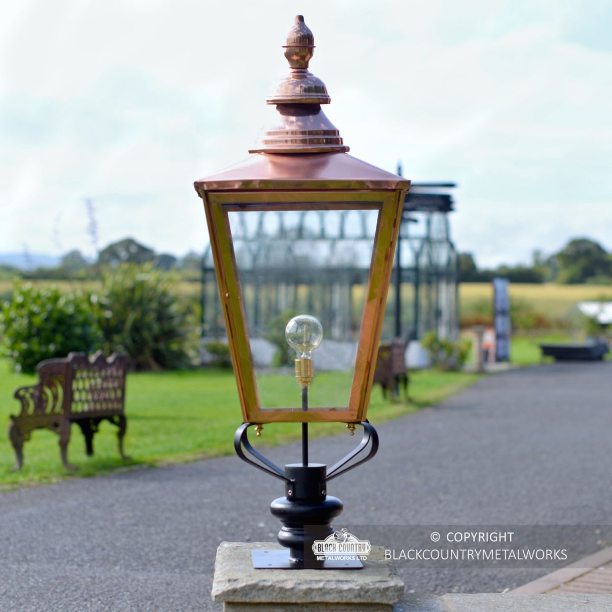 Copper Rochester Entrance Pillar Light in Situ on a Driveway