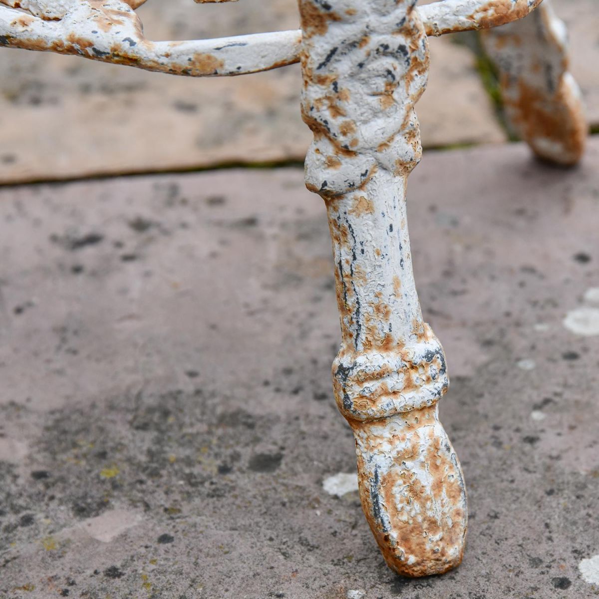 Close-up of the Feet on the "Rose" Aged Rustic Cream Cast Iron Side Stand Close-up of the Feet on the "Rose" Aged Rustic Cream Cast Iron Side Stand