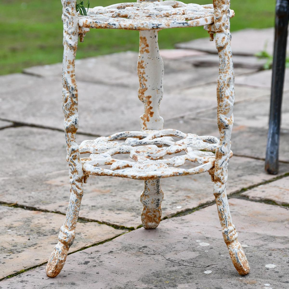 Close-up of the Bottom of the "Rose" Aged Rustic Cream Cast Iron Side Stand Close-up of the Bottom of the "Rose" Aged Rustic Cream Cast Iron Side Stand