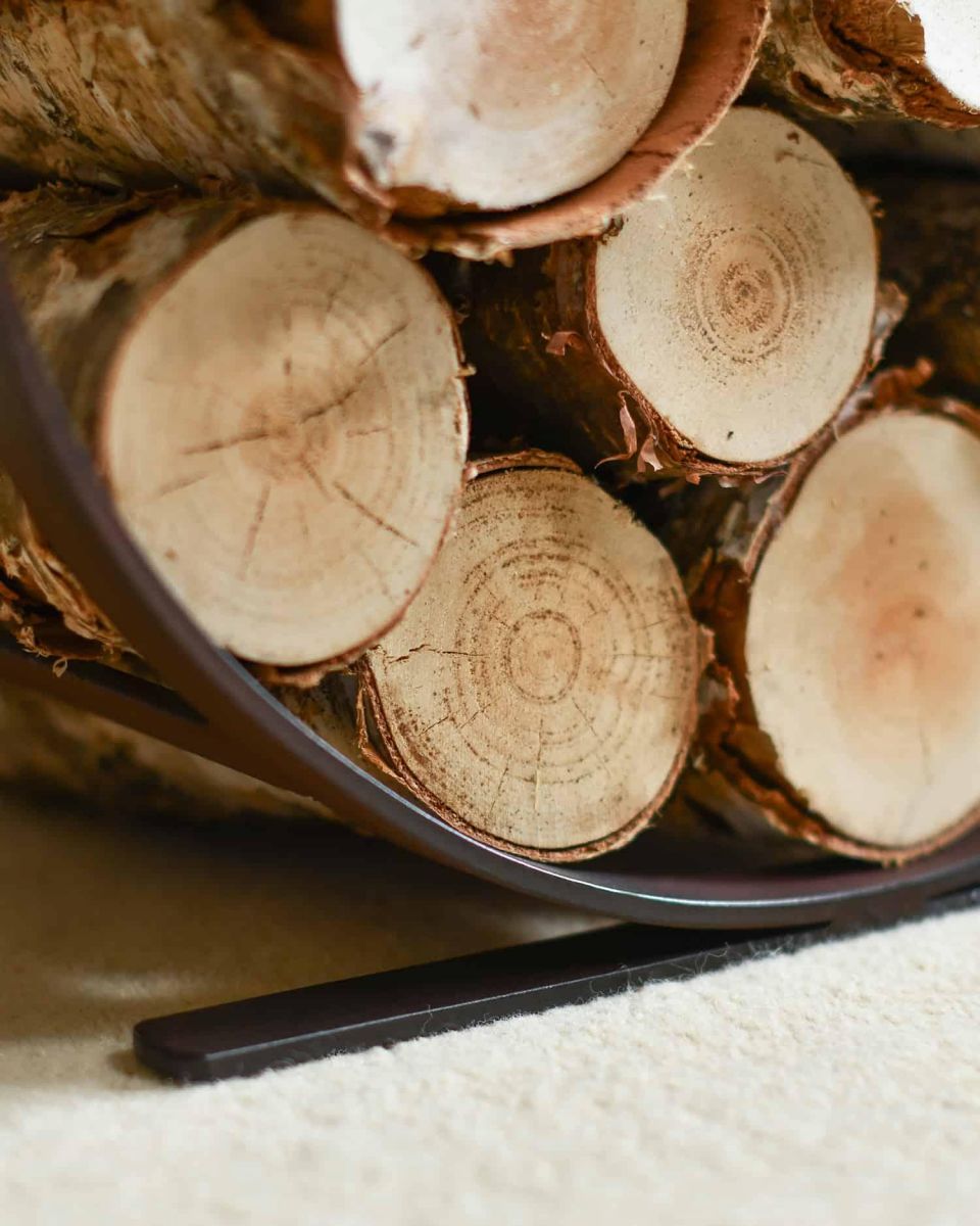 Close-Up of Rustic Blacksmith Curved Log Rack in Use