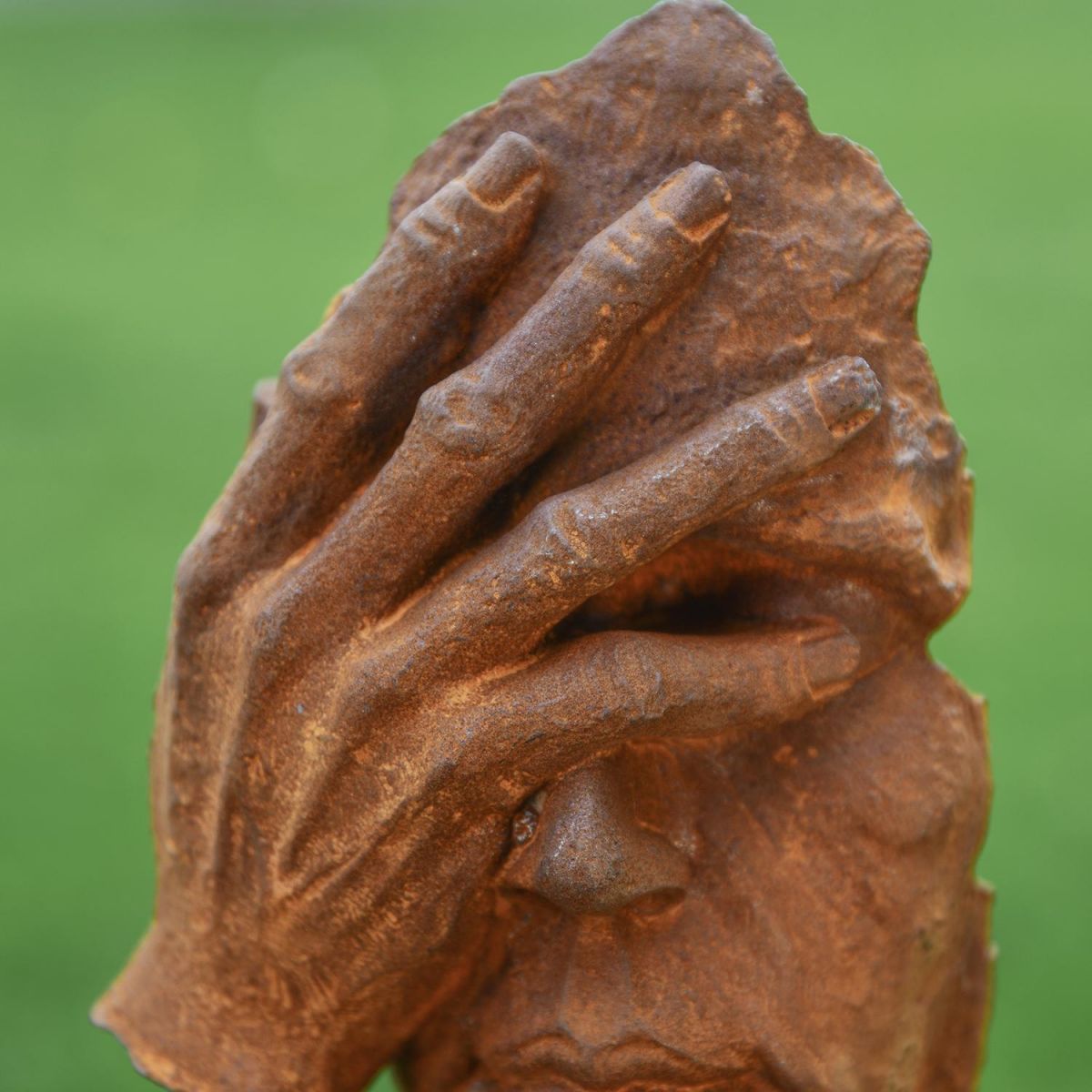 Close-up of the Rustic Finish on the Cast Iron Abstract Face Sculpture