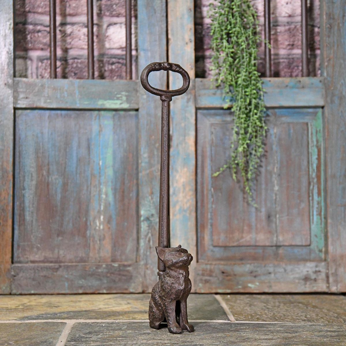 Rustic Cast Iron Cat Door Stop in Situ by a Rustic Door