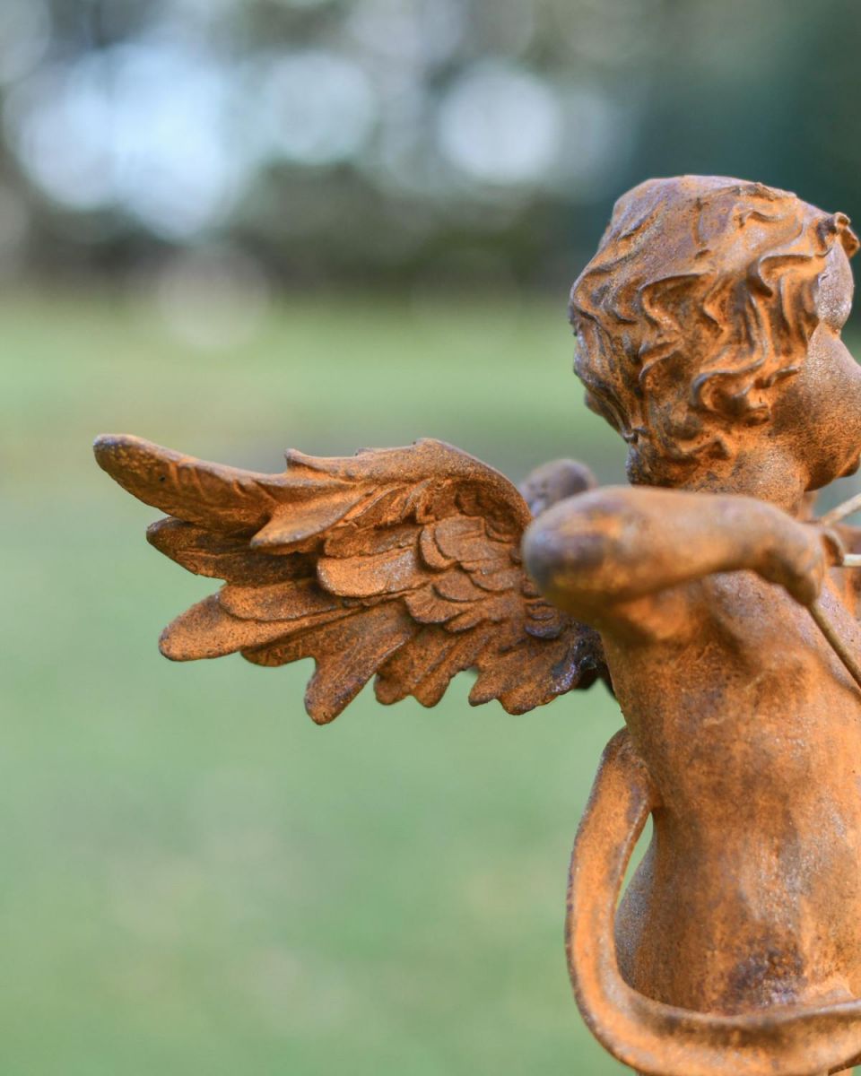 Close-Up of Winged Cupid Sculpture