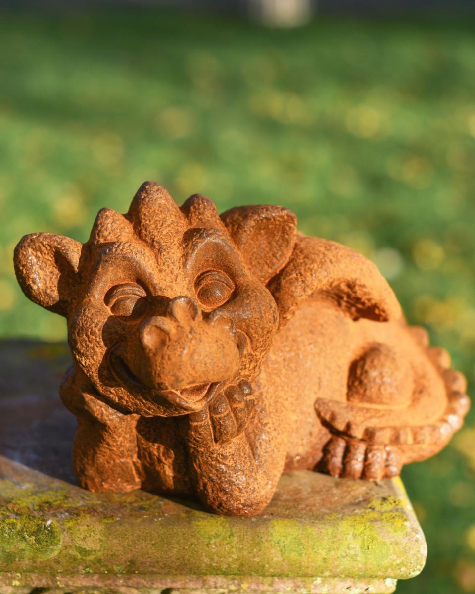 Rustic Cast Iron Daydreaming Dragon Garden Sculpture in Situ
