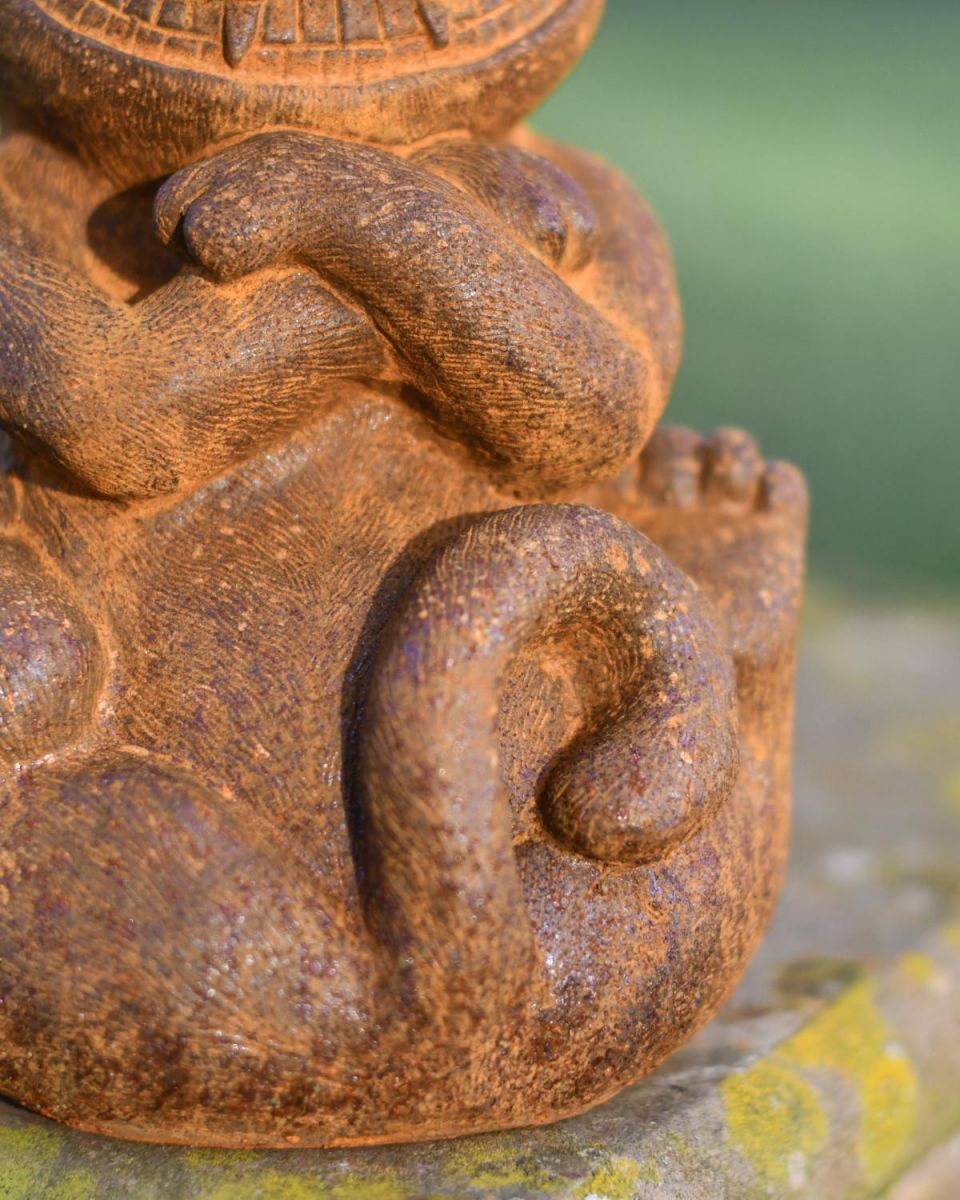 Close-Up of Base of Rustic Cast Iron Garden Sculpture