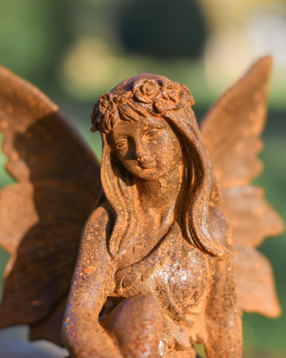 Close-Up of Rustic Cast Iron Guardian Angel Garden Sculpture