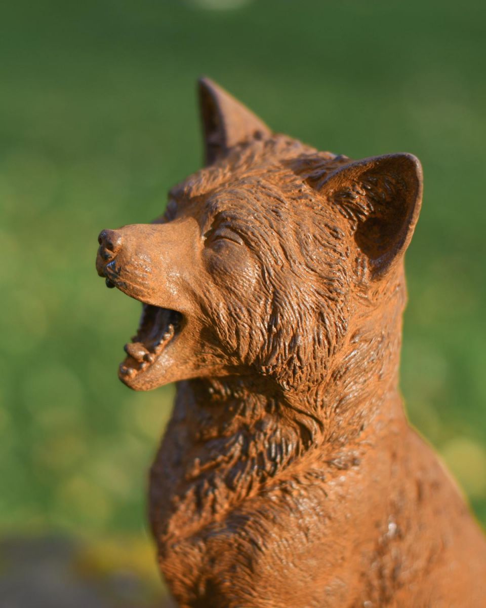 Close-Up of Rustic Cast Iron "Howling" Sitting Fox Garden Sculpture