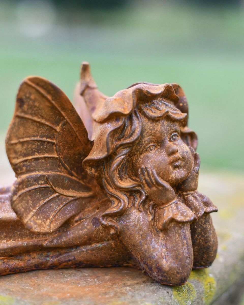 Rustic Cast Iron "Laying Angel" Garden Sculpture in Situ