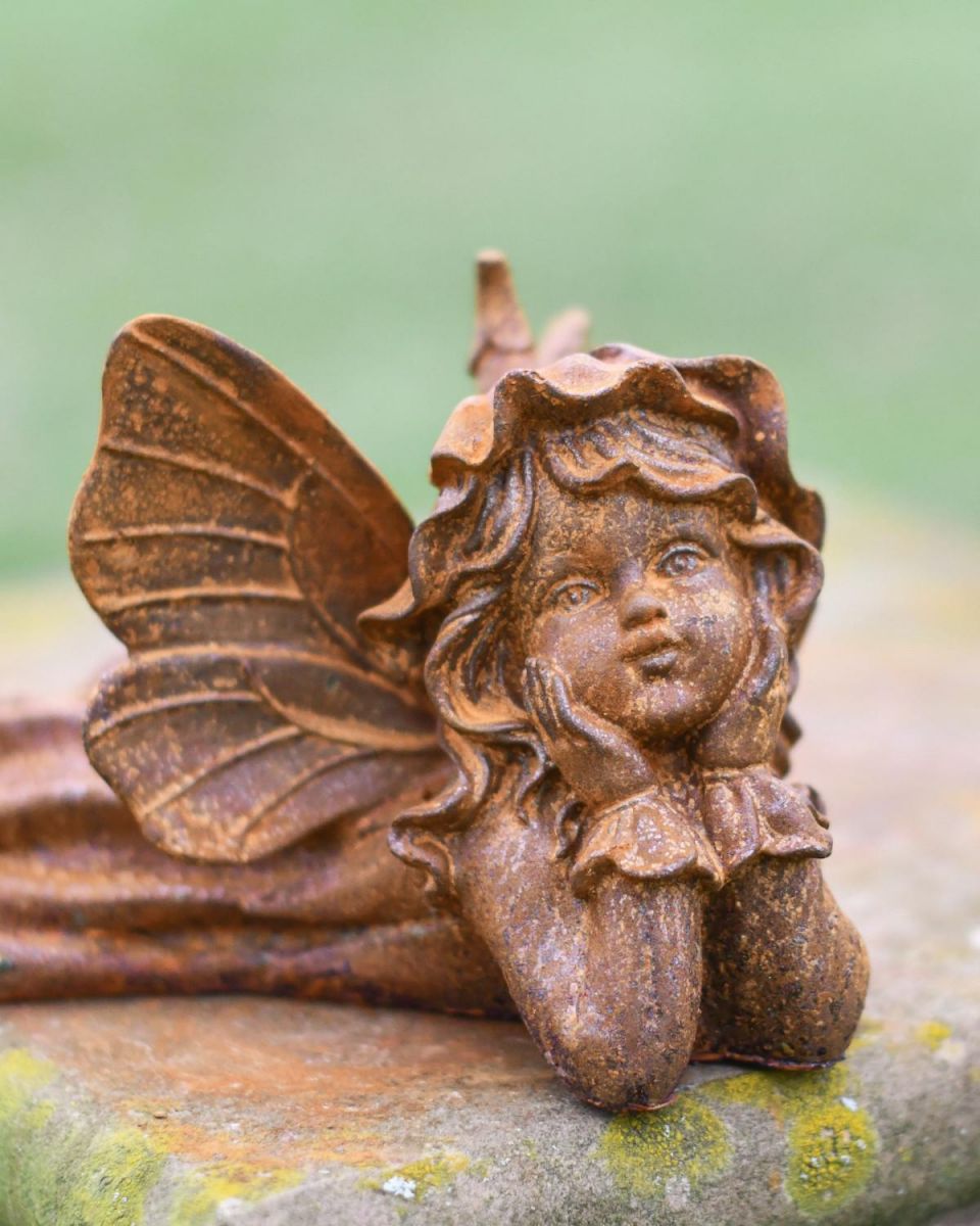 Close-Up of Rustic Cast Iron "Laying Angel" Garden Sculpture