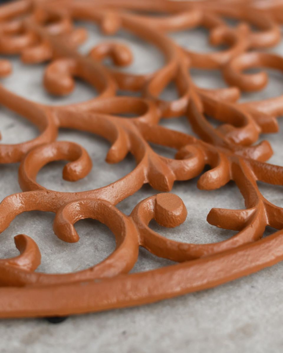 Close-Up of Delicate Twist Pattern on Rustic Cast Iron Door Mat