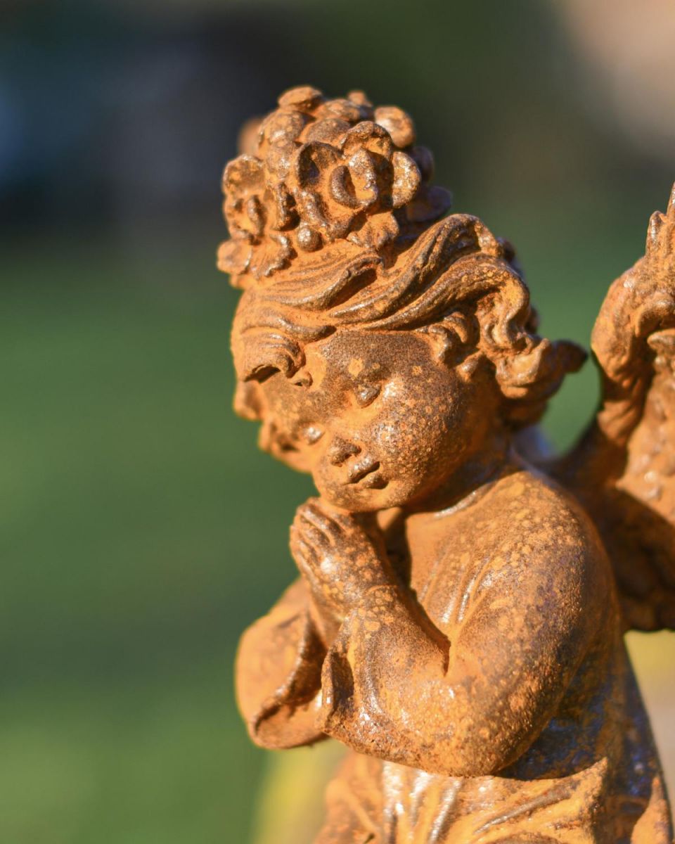 Close-Up of Rustic Cast Iron "Praying Angel" Garden Sculpture