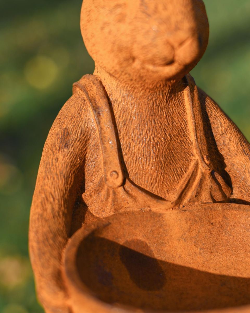 Close-up of the Detail on the Rustic Cast Iron Rabbit Holding Bowl Sculpture & Bird Bath Close-up of the Detail on the Rustic Cast Iron Rabbit Holding Bowl Sculpture & Bird Bath