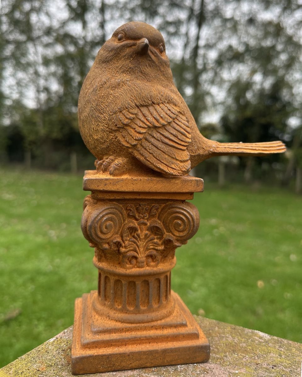 Close up of cast iron robin outdoor ornament