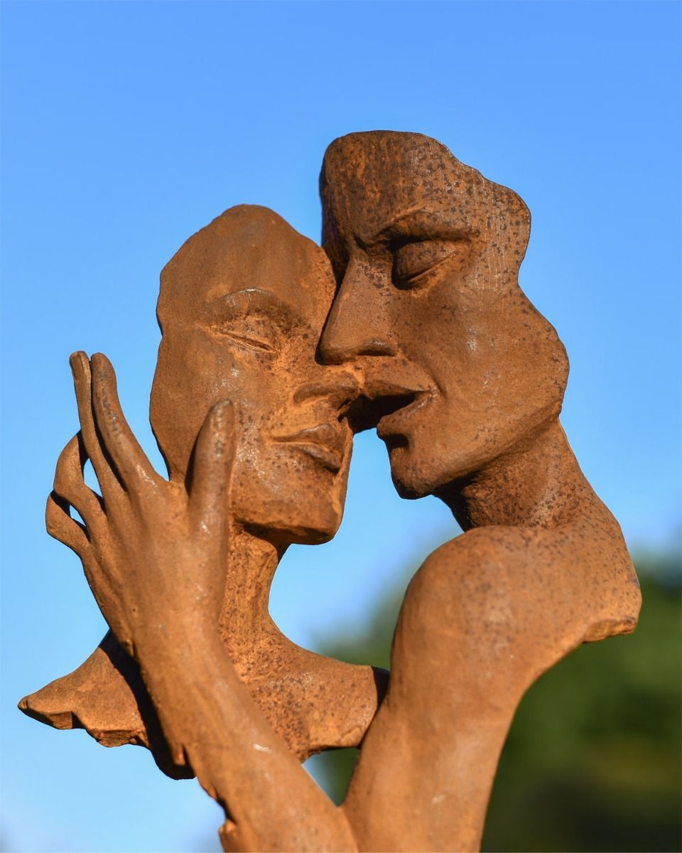 Close Up Of Cast Iron Rustic Embracing Couple Garden Sculpture