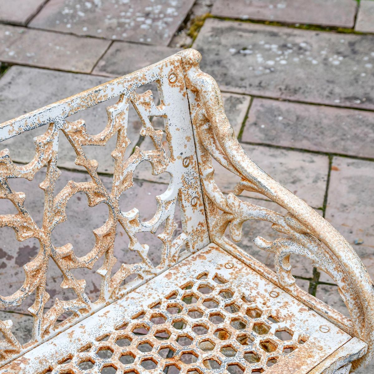 Close-up of the Aged Cream "Quatrefoil" Style of the Bench