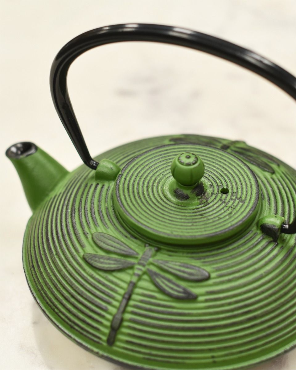 Close up of Black Handle and Embossed Dragonfly Pattern